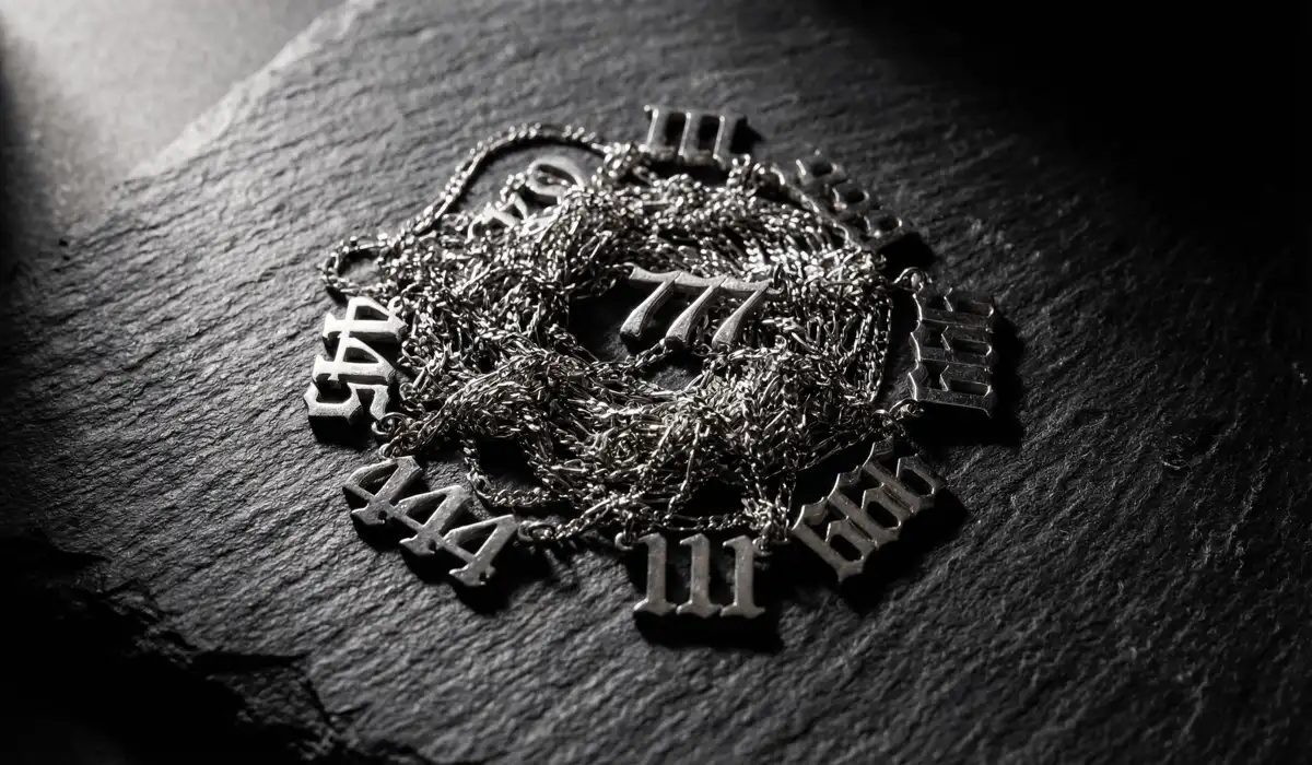 Seeing Multiple Angel Numbers: Understanding Their Combined Meanings 4 - Buddha Bodhis Tangled angel number necklaces on a dark background representing blocked spiritual energy and chaotic frequencies.