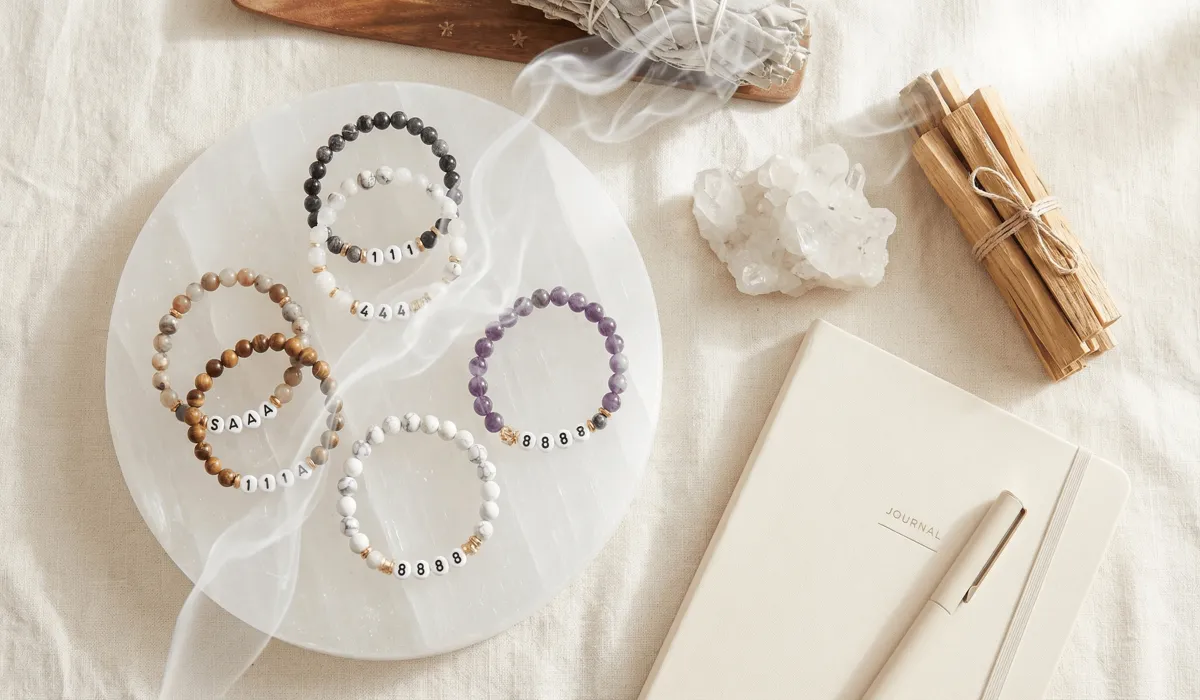 Seeing Multiple Angel Numbers: Understanding Their Combined Meanings 1 - Buddha Bodhis Spiritual cleansing ritual for angel number jewelry featuring selenite, sage smoke, and crystals.