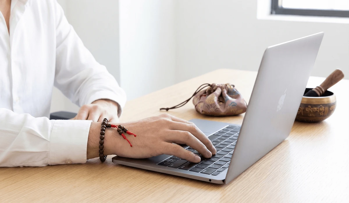 Choosing Between a 108 Mala Necklace and a Wrist Mala for Japa Meditation 3 - Buddha Bodhis A 27-bead wrist mala worn as a portable mindfulness tool in a modern work environment.