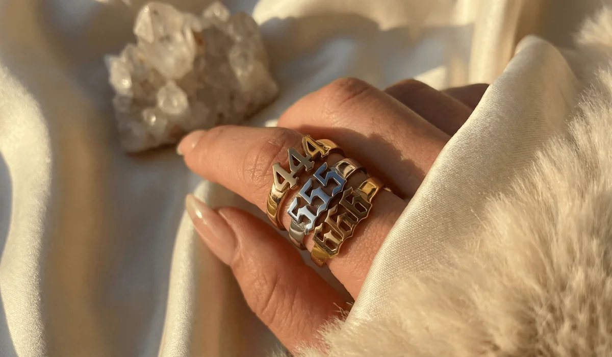 The Spiritual Significance of Stacking 444, 555, and 666 Angel Number Rings - Buddha Bodhis A stack of 444, 555, and 666 angel number rings in gold and silver, symbolizing spiritual synergy and modern numerology fashion.