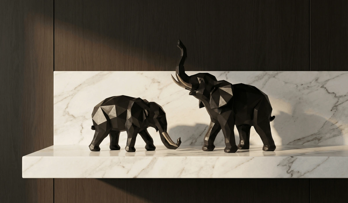 The Spiritual Meaning and Benefits of Elephant Statues in Home Decor 1 - Buddha Bodhis Comparison of trunk up and trunk down elephant statues in a modern minimalist interior symbolizing prosperity and grounding.