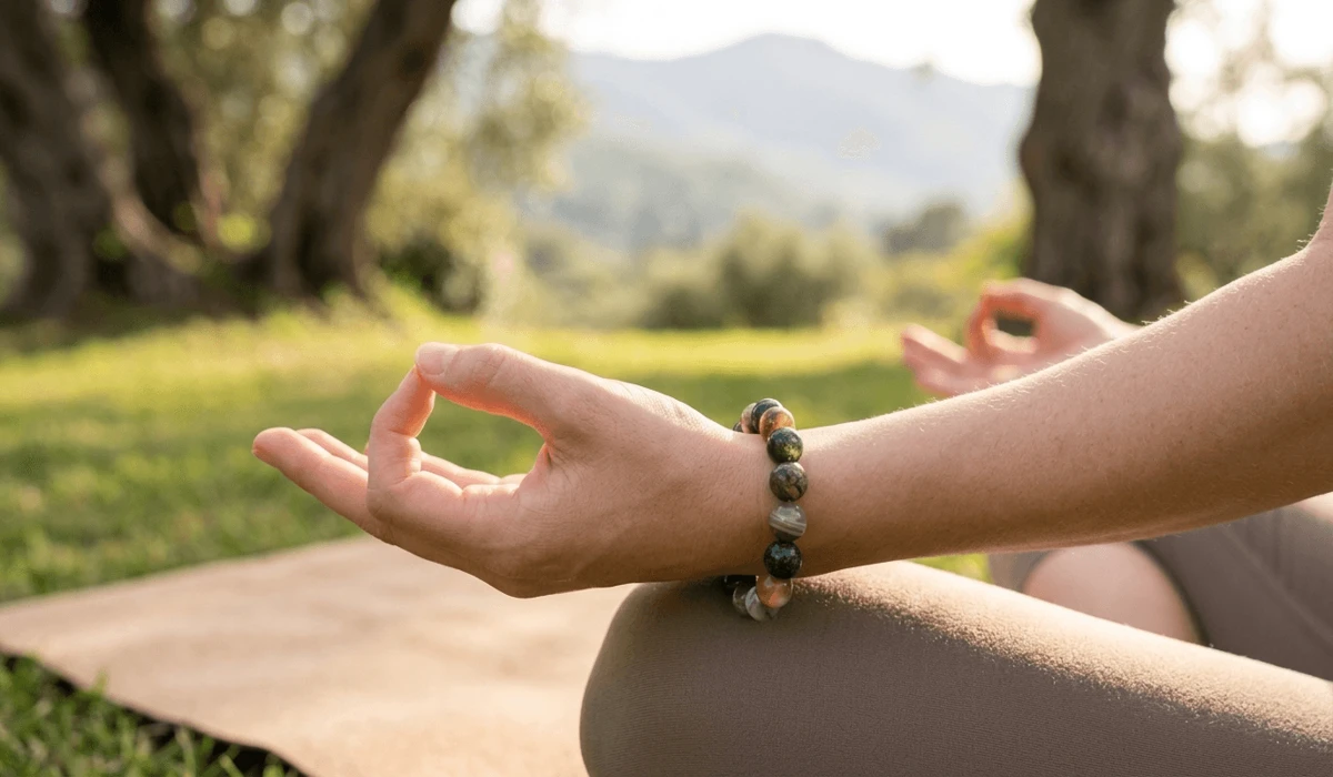How to Identify Real Agate: A Guide to Spotting Dyed and Synthetic Stones 3 - Buddha Bodhis Wearing a natural agate bracelet on the left hand for receiving grounding and protective energy during yoga.