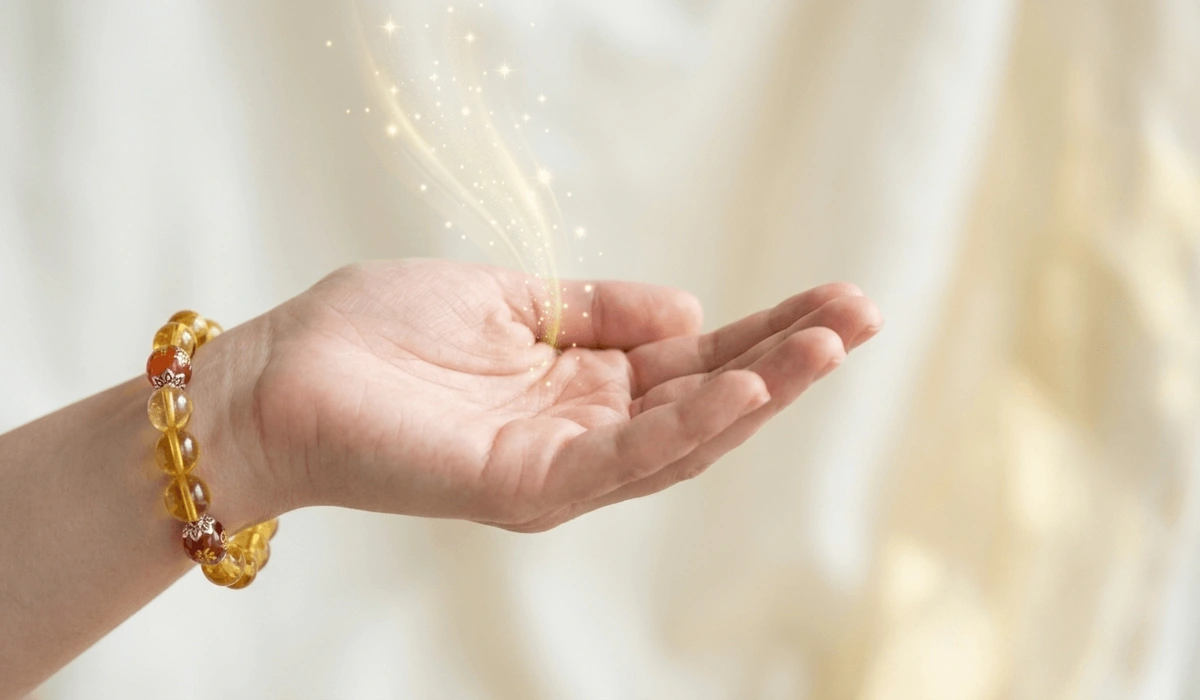 Which Hand Should You Wear a Citrine Bracelet on to Attract Wealth? 3 - Buddha Bodhis Close-up of a Citrine bracelet on the left hand representing the receptive side to attract wealth and abundance in Feng Shui.