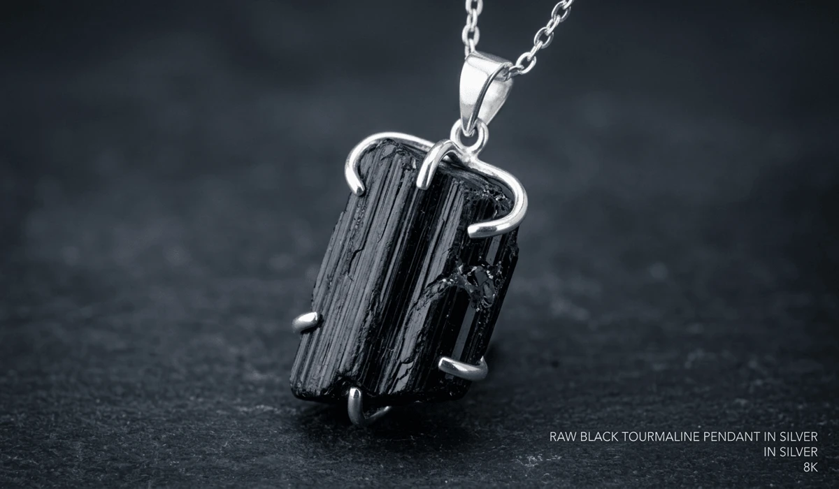 Black Tourmaline Pendant: Spiritual Meaning, EMF Protection, and Healing Benefits - Buddha Bodhis Close-up of a raw Black Tourmaline pendant showing natural vertical striations and Schorl crystal texture for grounding.