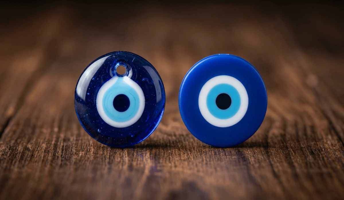 How to Identify a Real Evil Eye: Glass vs. Plastic Amulets - Buddha Bodhis Side-by-side macro comparison showing authentic hand-blown glass evil eye bead depth versus synthetic plastic bead.