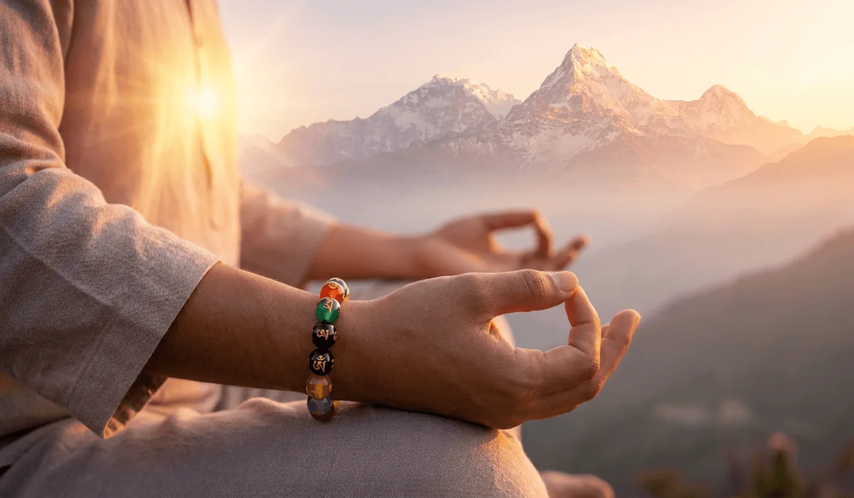 The Sacred Meaning and Benefits of the Om Mani Padme Hum Bracelet 2 - Buddha Bodhis Spiritual meditation illustration showing an Om Mani Padme Hum bracelet and golden heart chakra energy activation.