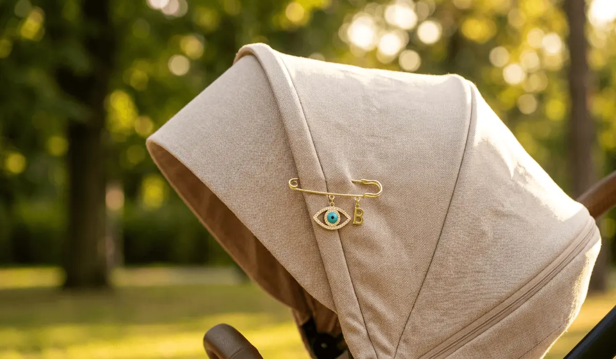 Why an Evil Eye Pin Makes a Meaningful Gift for a New Mother 2 - Buddha Bodhis Gold Evil Eye brooch pinned safely to the canopy of a luxury baby stroller for outdoor protection against negative energy