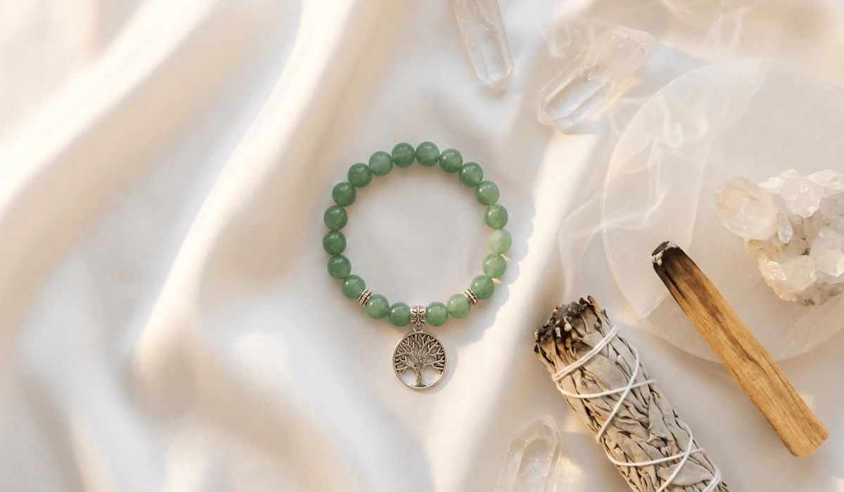 Which Hand Should You Wear a Tree of Life Bracelet On? Left vs. Right Wrist Meaning - Buddha Bodhis Sacred spiritual cleansing tools including a Tree of Life bracelet, white sage smoke, Palo Santo stick, and selenite charging plate.